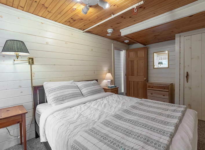 Hotel room with antique white wooden walls in North Conway