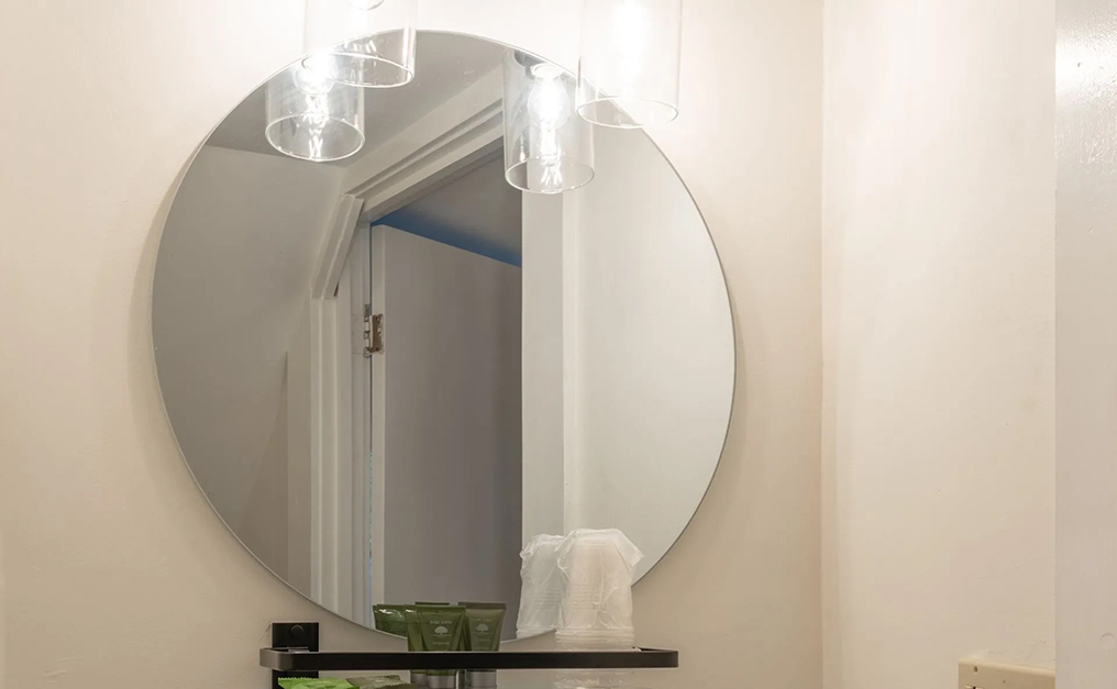 Close up of circular mirror on wall