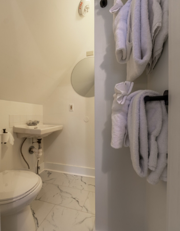 Stack of folded white towels in bathroom